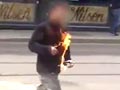 实拍挪威杀人狂受审 不明男子庭外自焚
