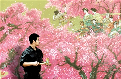 赵毅正创作壁画《春风十里桃花红》。