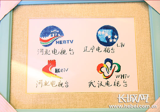 自闭症孩子亲手绘制的台标.邢丁 摄